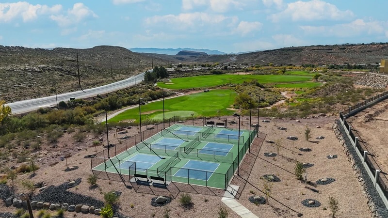 Aerial view of ISLE's three pickleball courts overlooking the Coral Canyons golf course – Isle 64 vacation rental in Washington, Utah near St. George and Zion