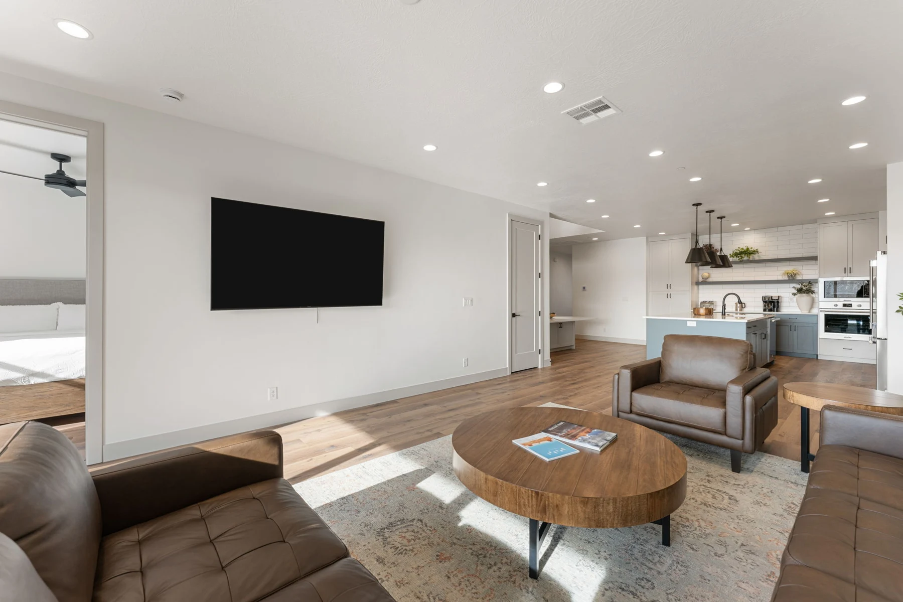 Living room with sectional seating and television – Isle 64 vacation rental in Washington, Utah near St. George and Zion