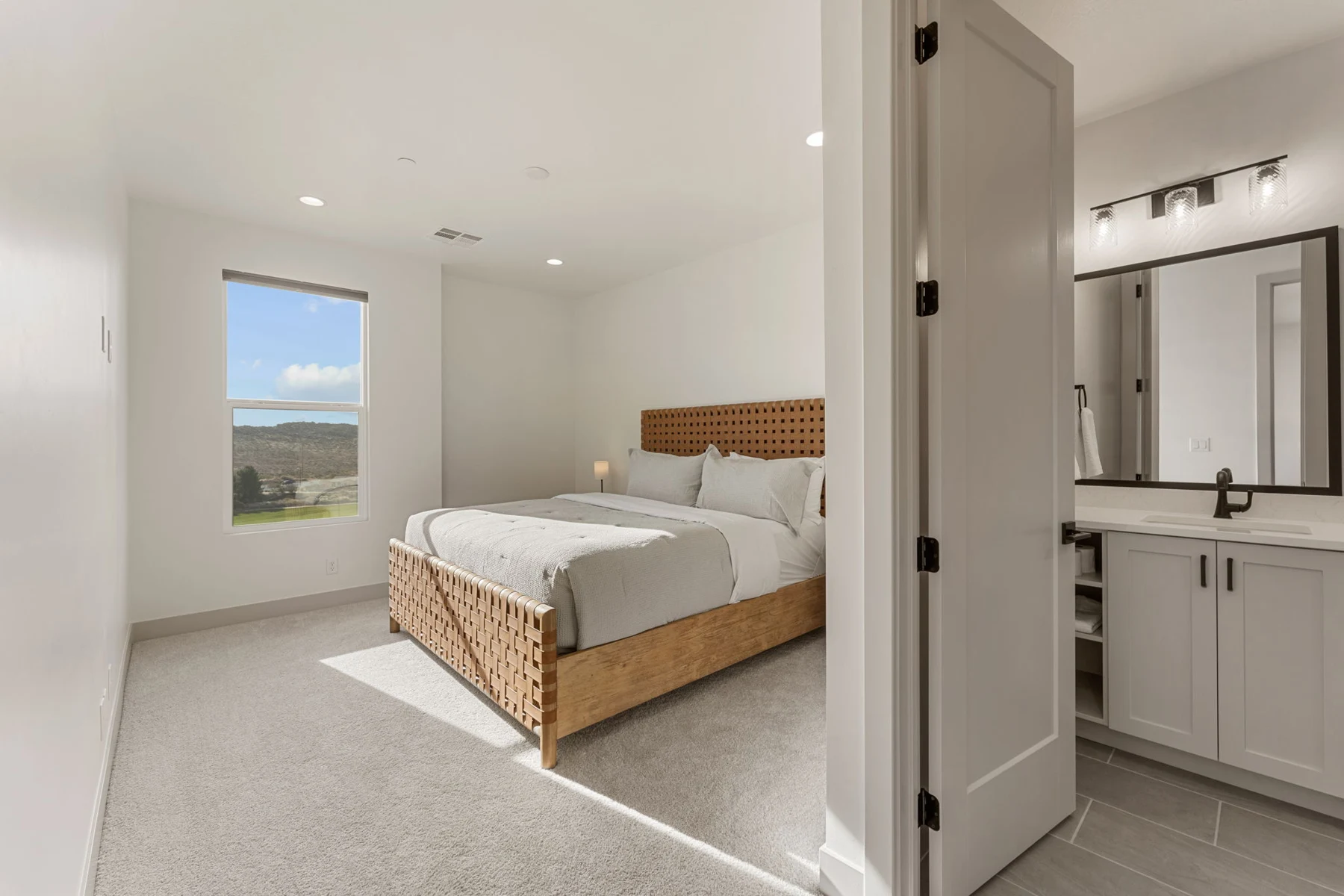 King bed and adjoining bathroom – Isle 64 vacation rental in Washington, Utah near St. George and Zion