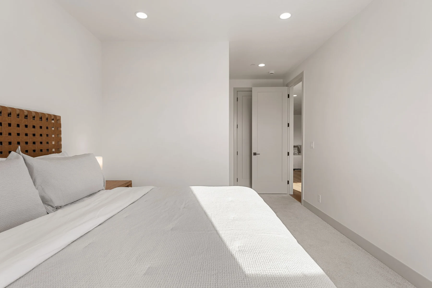 King bedroom with upholstered bed – Isle 64 vacation rental in Washington, Utah near St. George and Zion