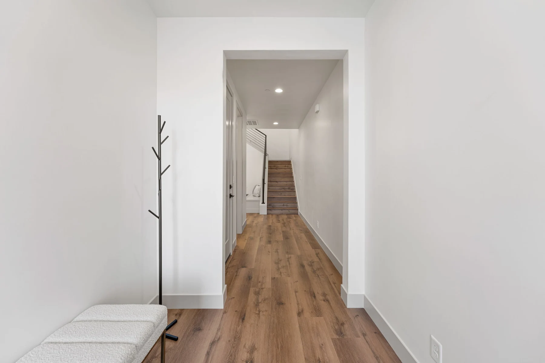 Bright entryway with coat rack and bench – Isle 64 vacation rental in Washington, Utah near St. George and Zion
