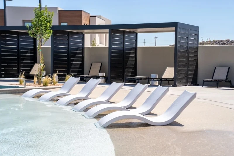 Poolside loungers and shaded cabanas – Isle 64 vacation rental in Washington, Utah near St. George and Zion